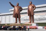 Picture: Bowing to the statues of Kim Il Sung and Kim Jong Il on Mansu Hill in Pyongyang, North Korea courtesy J.A. de Roo courtesy Wikipedia.