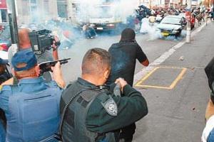 Picture: Police attack demonstration during the 2006 South African security guards strike courtesy Derek Blackadder/SATAWU/flickr.