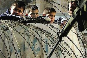 Picture: Boys in Gaza fenced in behind a barricade courtesy Dale Spencer/flickr
