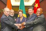 Picture: BRICS heads of state and government hold hands ahead of the 2014 G-20 summit in Brisbane, Australia, courtesy Roberto Stuckert Filho/Agencia Brasil