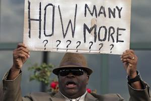 Picture: Reverend Doctor Arthur Prioleau holds a sign during a protest in North Charleston, courtesy Sydney Morning Herald